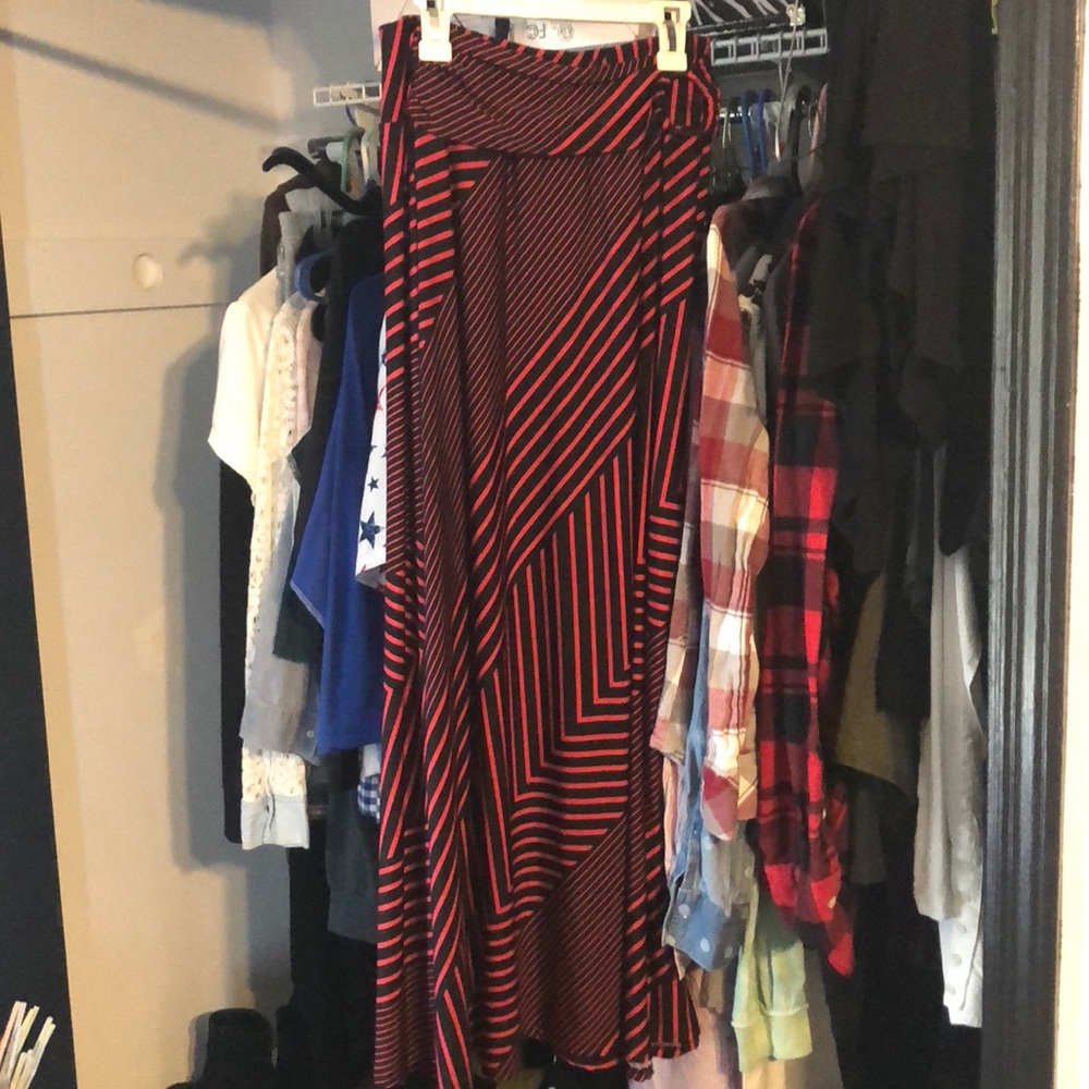 A hot pink and black striped long maxi type skirt